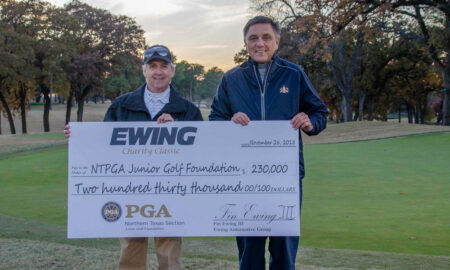 Fin Ewing III (left), owner of The Ewing Automotive Group, presents a check to Northern Texas PGA president Ronny Glanton with proceeds from the Ewing Charity Classic at Brook Hollow Golf Club in Dallas on Nov. 26, 2018.