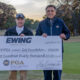 Fin Ewing III (left), owner of The Ewing Automotive Group, presents a check to Northern Texas PGA president Ronny Glanton with proceeds from the Ewing Charity Classic at Brook Hollow Golf Club in Dallas on Nov. 26, 2018.