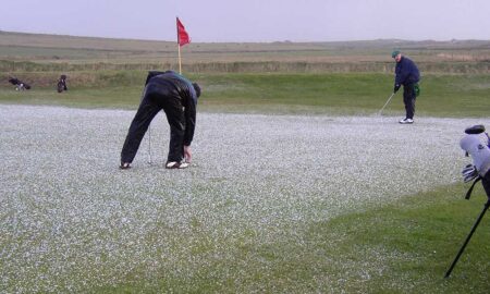 On a 2002 Dr. Joe Gruss Gets Ready to Putt through the Hail (Photo Courtesy of Dr. Bryan Williams)