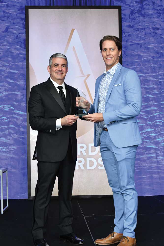 Jason Gamel, President and CEO of ARDA presents Aaron Stewart with his ACE Emerging Leader Award