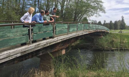 The Salmon-Safe science team with Dan Smith of the City of Tumwater on a bridge spanning the Deschutes River at Tumwater Valley Golf Club