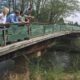 The Salmon-Safe science team with Dan Smith of the City of Tumwater on a bridge spanning the Deschutes River at Tumwater Valley Golf Club