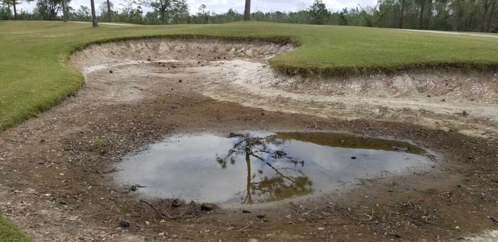 A poorly-draining golf course bunker before renovation