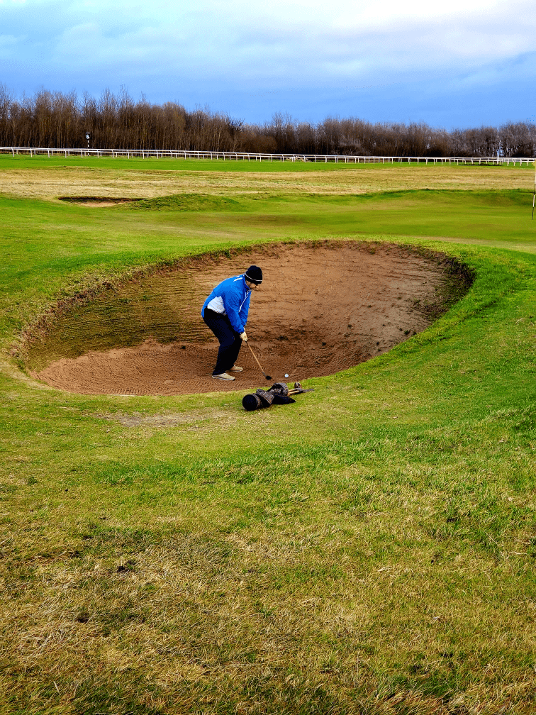 Ben Ellis Making a  Bunker Shot on the Old Course at Mussleburgh in Scotland