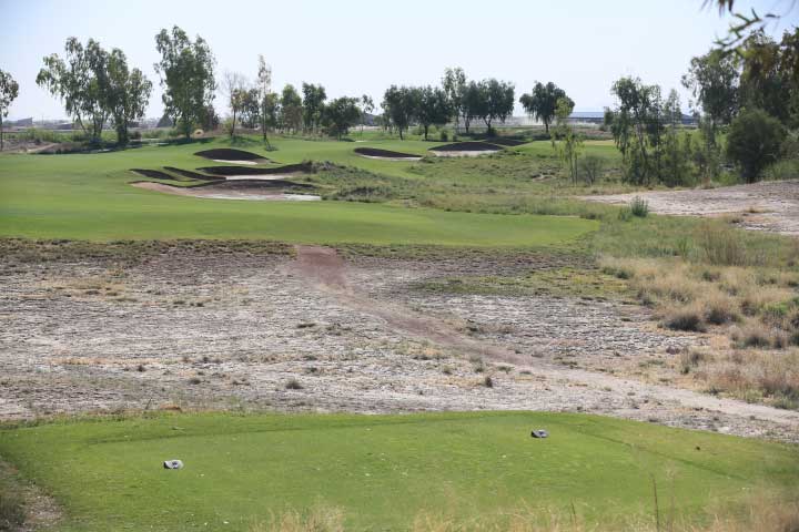 Fairway bunkers, before renovation, as seen from the tee box on the fifth hole at Ak-Chin Southern Dunes Golf Club in Maricopa, Arizona.