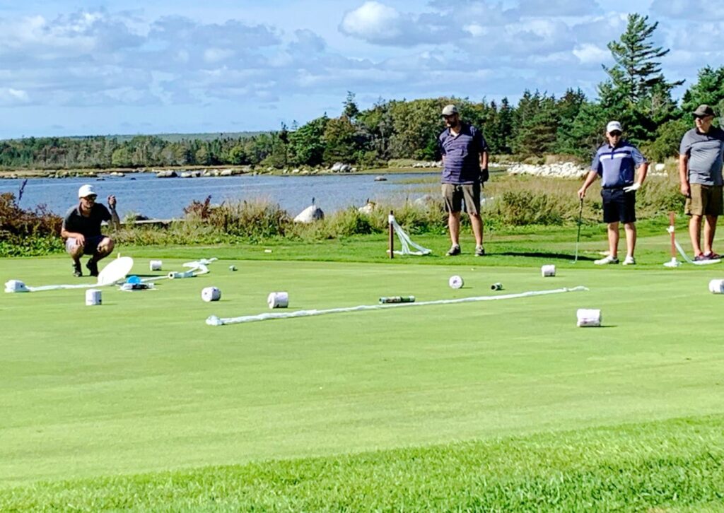 Plungers, toilet paper, and magazines made for crappy putting on #2 at the River Hills Golf and Country Club in Clyde River during the Superintendent Revenge Scramble. - Kathy Johnson