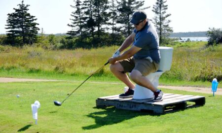 Teeing off while sitting on a toilet bowl was just one of the challenges awaiting golfers at the River Hills Golf and Country Club in Clyde River during the first-ever Superintendent Revenge Scramble on Sept. 22. - Kathy Johnson