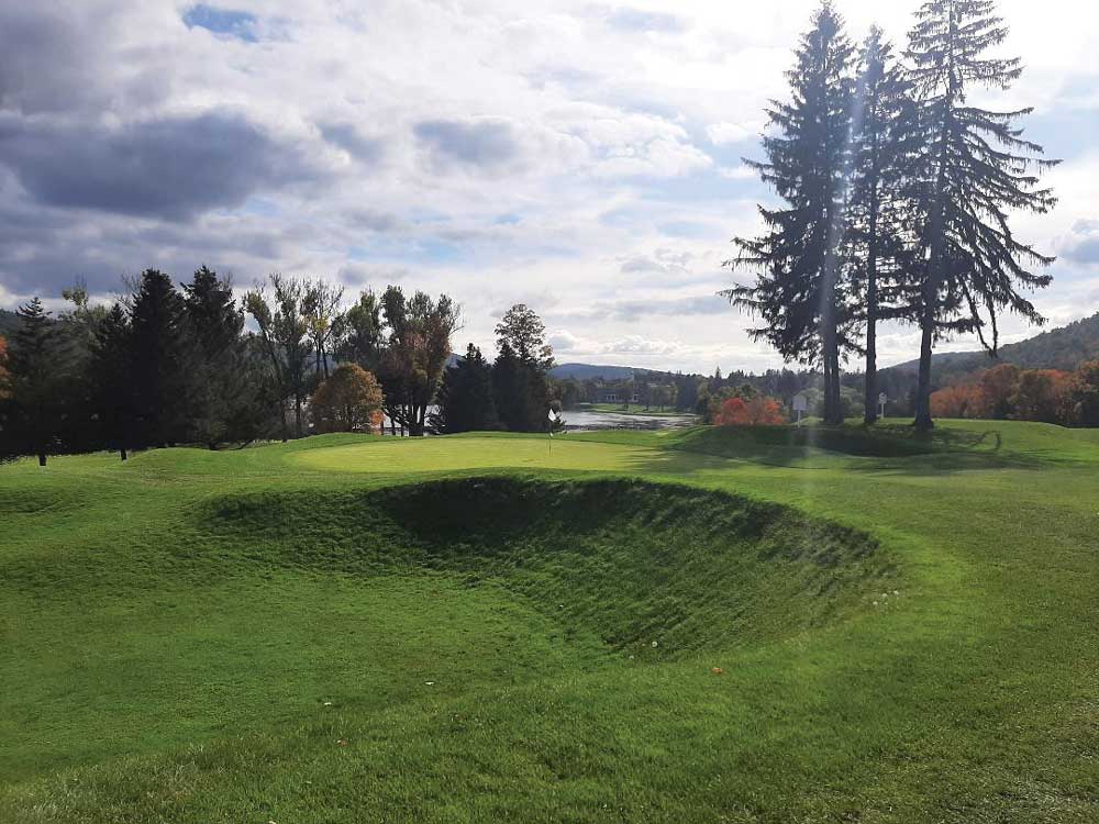 THE GREENSIDE GRASS BUNKER AT THE SORT PAR-4 13TH IS LARGER THAN THE 2000 SQUARE FOOT GREEN - Leatherstocking Golf Course