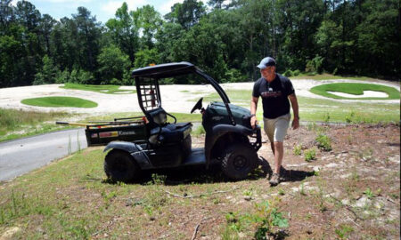 Chris Dwiggins, golf superintendent at Woodlake, on the 8th hole of the community’s Ellis Maples-designed course. Photograph by Ted Fitzgerald/The Pilot