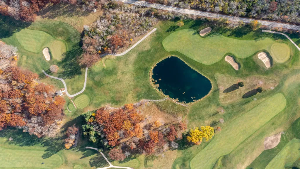 The opened-up 14th (top), playing over water and uphill