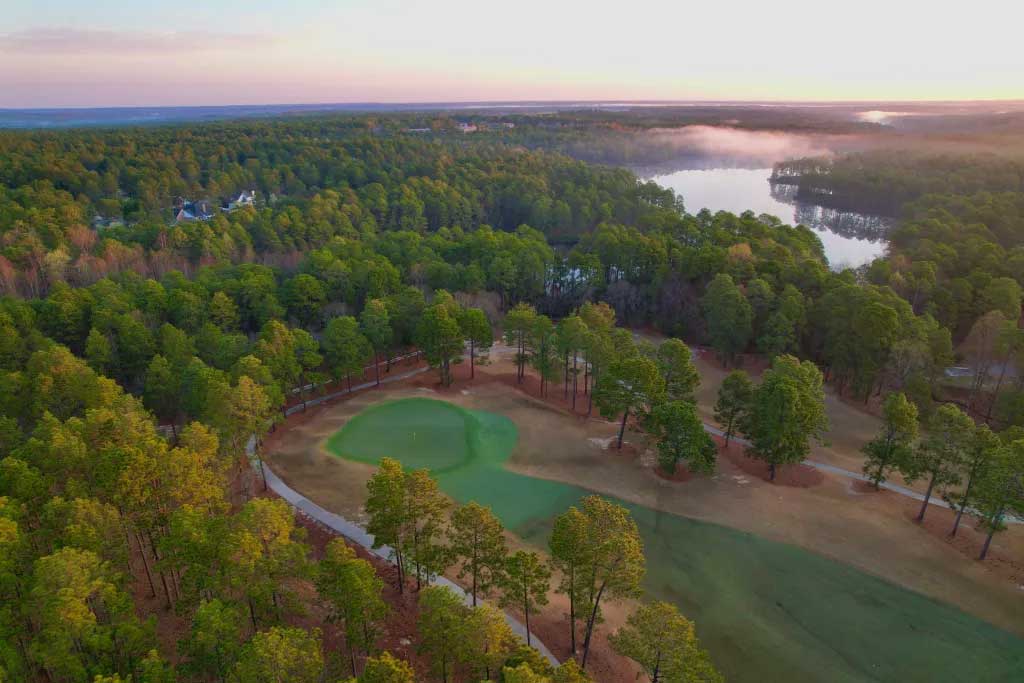 Aerial shot of the 8th green as the morning mist burns off the lake.