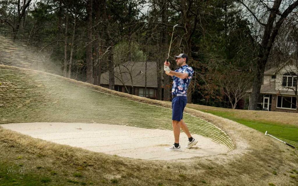 Paul takes on a sod wall bunker with a great shot