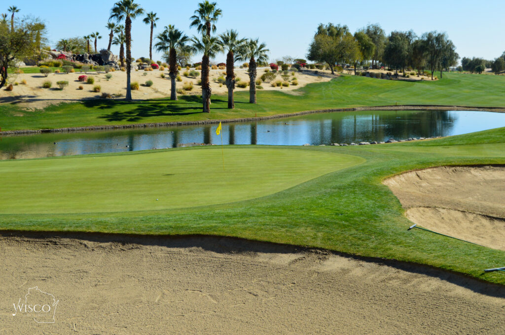 The par 5 second features an approach shot over a pond with bunkers guarding bail-out zones long and left