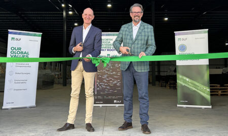 DLF's Soren Halbye and Neil Douglas Cutting Ribbon at New Facility