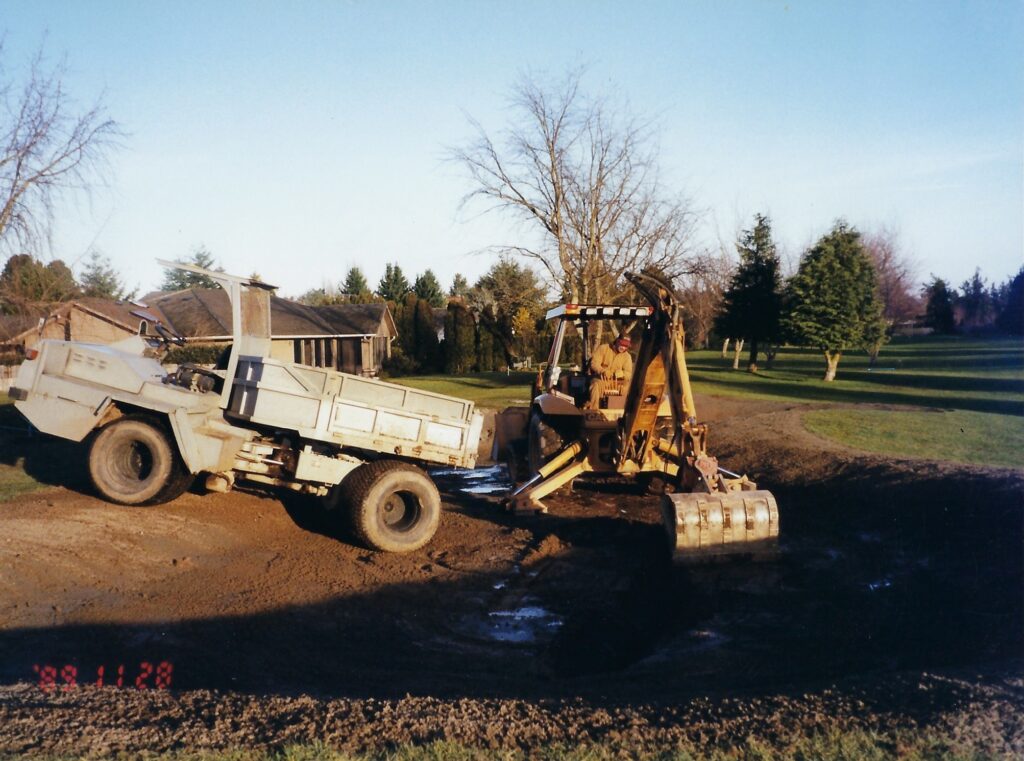 Kip working the backhoe on Broadmoor GC's 12th hole in 1995